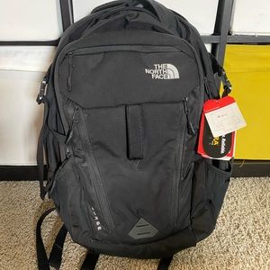 The north face Surge backpack in solid black.
